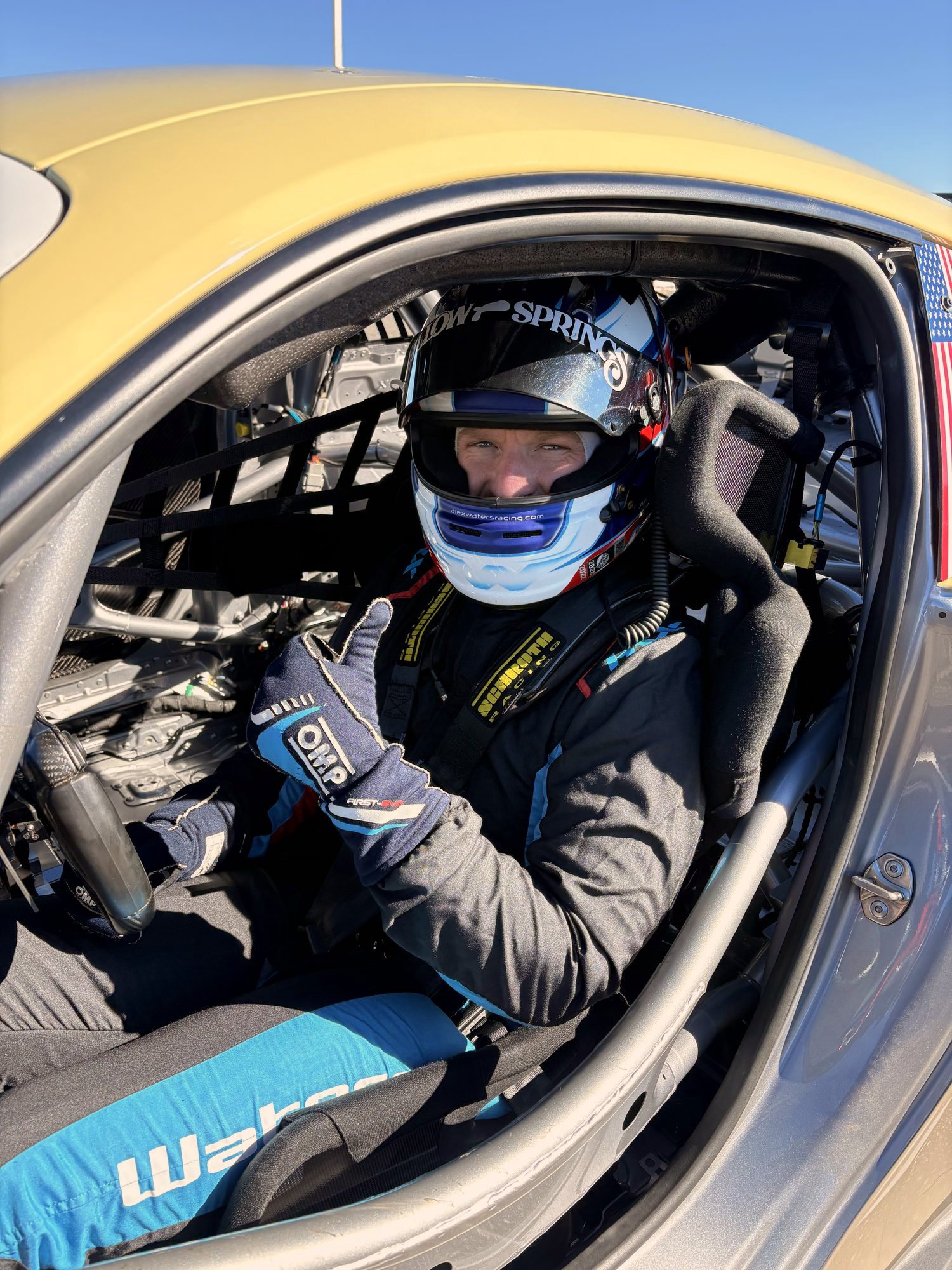 Alex Waters strapped into a Porsche 911 GT3 Cup car