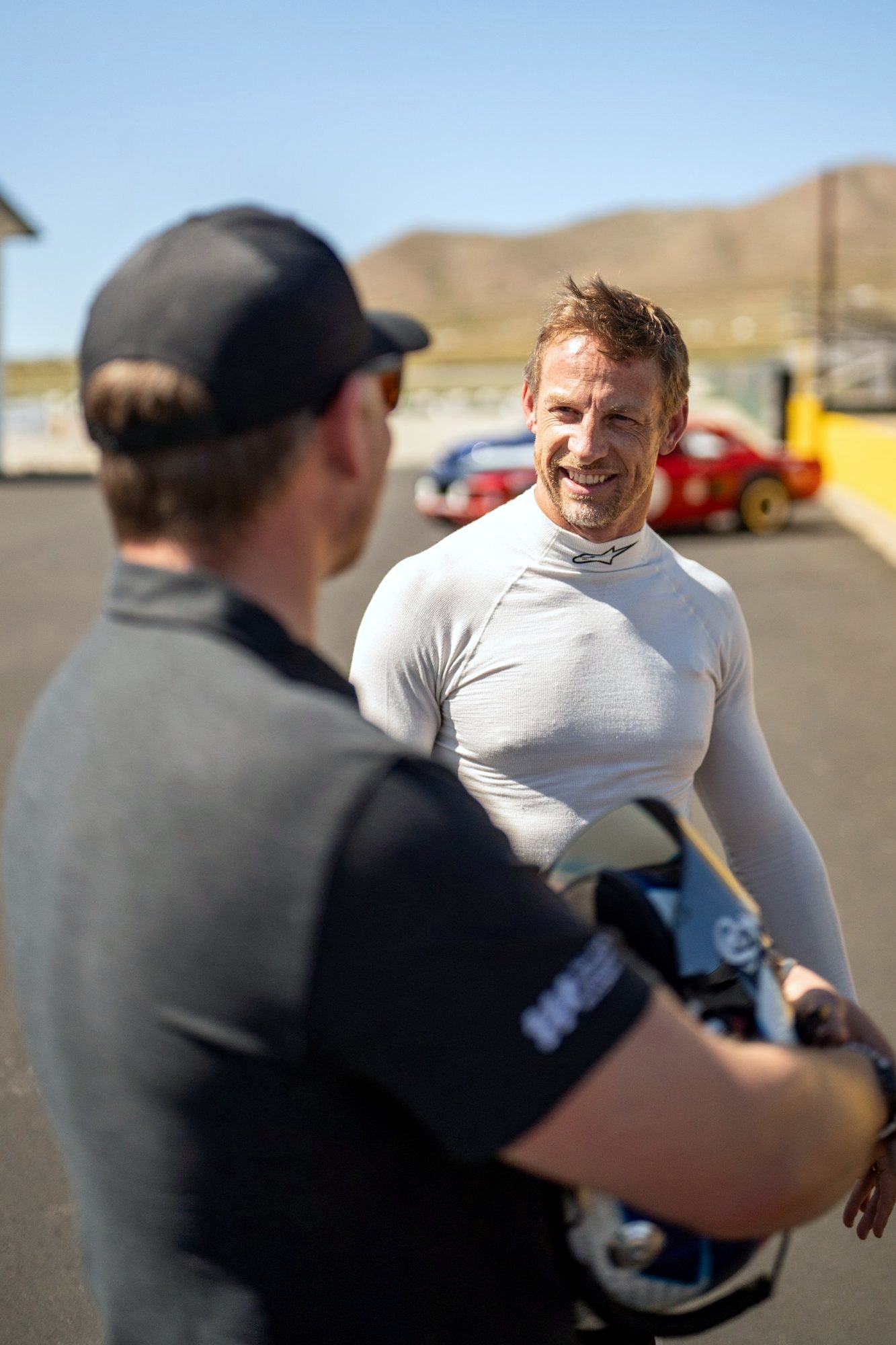Alex Waters coaching Jenson Button trackside