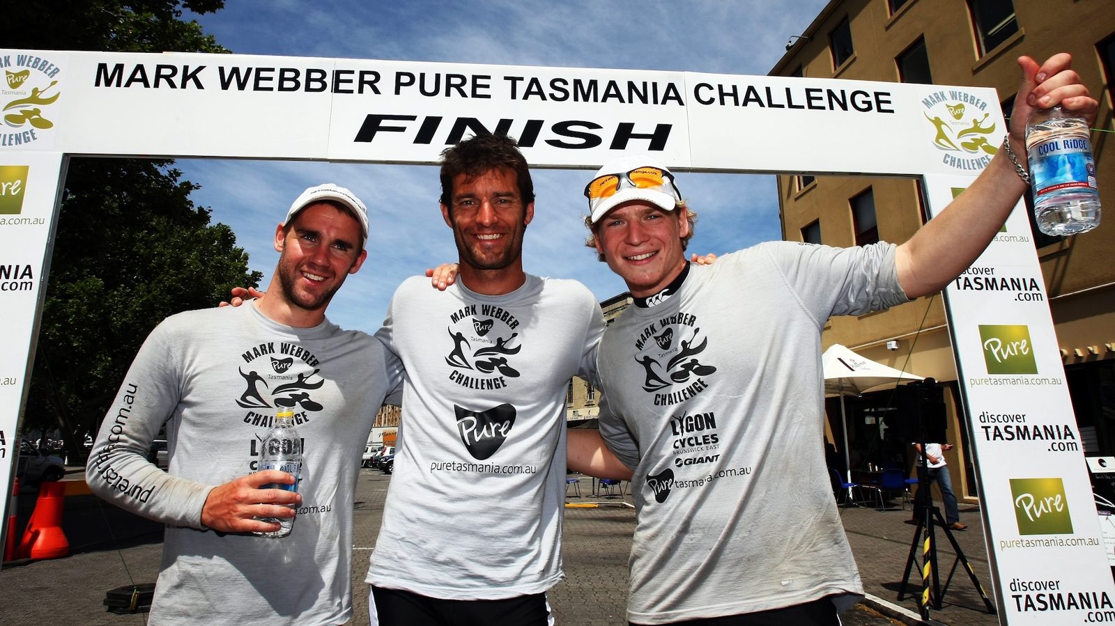 Alex Waters with Mark Webber at the Pure Tasmania Challenge finish